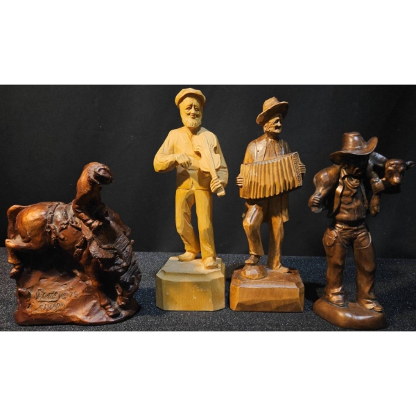 Four Hand-Carved Wooden Figurines Marked Canada, AM, and Carl