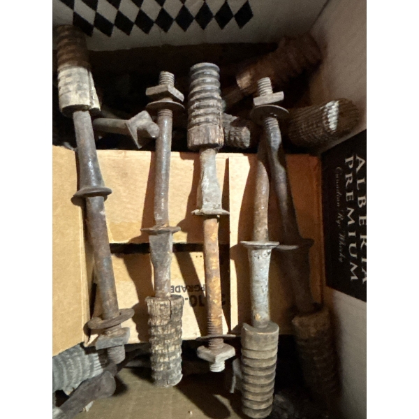 box of vintage insulator pegs