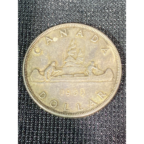 1958 Canada Silver Dollar Featuring Queen Elizabeth II and Voyageur Design