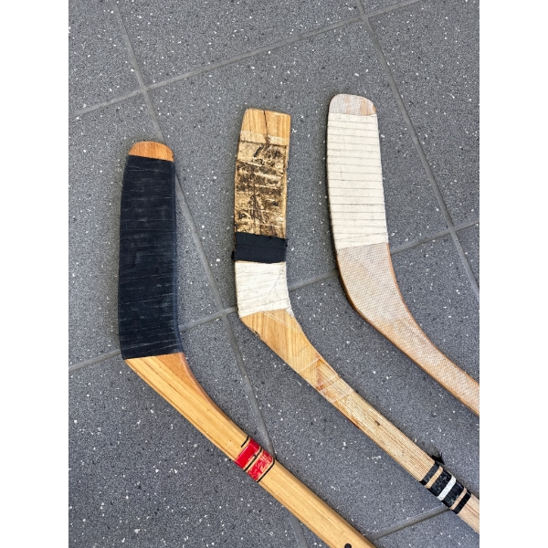 Three Wooden Hockey Sticks by CCM, Canadien, and Others