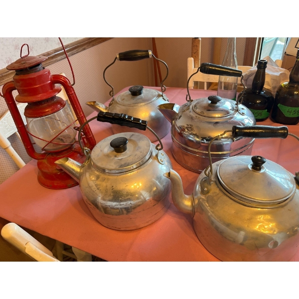 Antique stove kettles 4 in total with a red antique lantern with original glass made in Canada