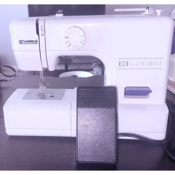Kenmore Sewing Machine with Foot Pedal and Assorted Sewing Patterns
