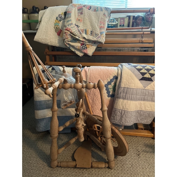 Collection of handmade quilts, and a very old wood spinning wheel