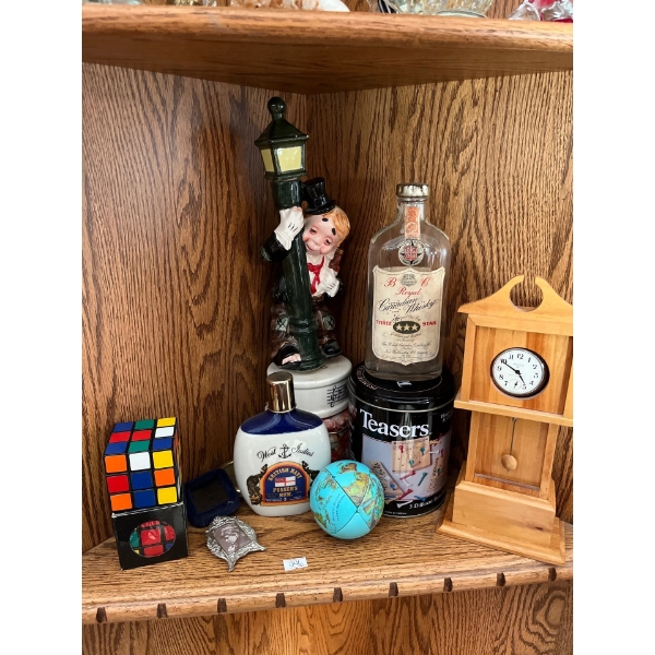 Musical spin box ceramic boy, 1932 Royal Canadian whiskey bottle, west indies British navy pussers r