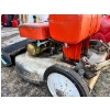 Image 4 : Lawn Boy lawnmower, gas jug, and homemade manual chainsaw. A true handyman special. 

