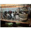 Image 1 :  Tires, lawnmower motors, jacks Bottom left shelf.