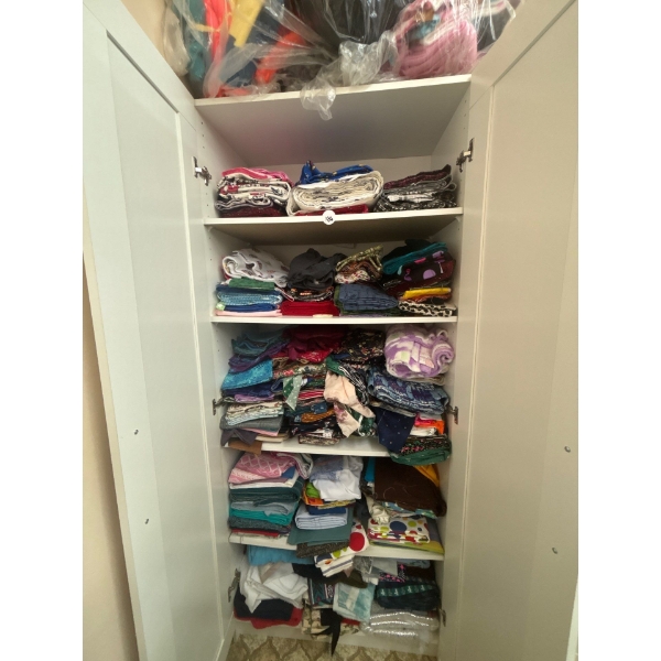 cupboard full of fabric a number of variety of prints includes cabinet