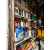 Image 3 : several barrels of oil, gas cans, both diesel and unleaded vintage oil cans. 