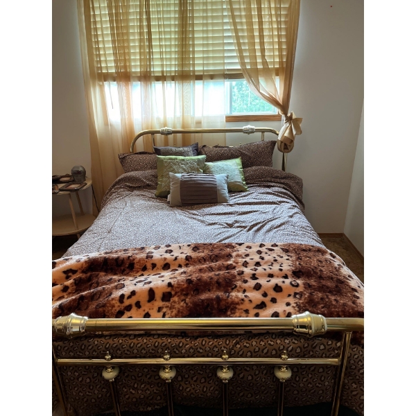 Brass bed with head rails and foot rail with all linens