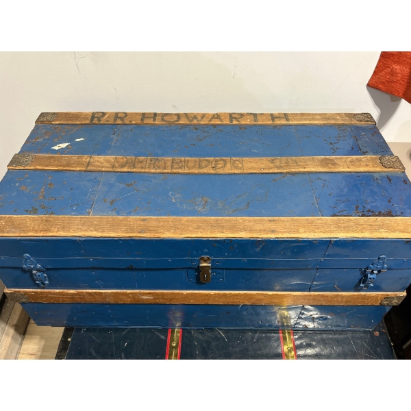 Blue cedar shipping trunk with a collection of burlap bags 