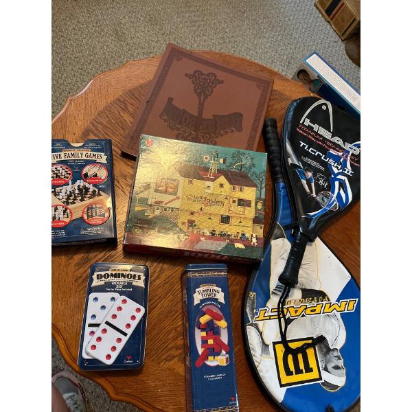  Two tennis rackets with a collection of games and vintage puzzle and a scrapbook