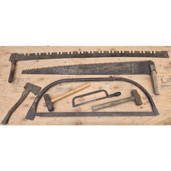 Vintage Hand Tools Including Saws, Axes, and Hammers