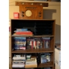 Image 1 : Shelf with a number of books, office supplies, printer with printer ink still with storage underneat