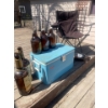 Image 2 : Foldable Lawn Chair, Vintage Cooler, 2 Empty Texas Mickeys, 4 Empty Beer Jugs.