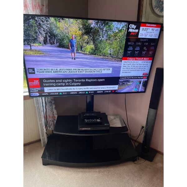  LG 65 inch TV with stand and LG surround sound, including remote controls