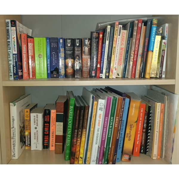 Two Shelves Of Assorted Books