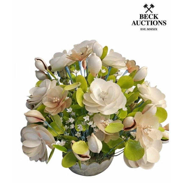 ecorative arrangement featuring moon scallop (Amusium pleuronectes).