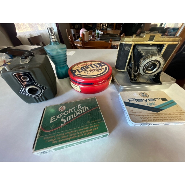  2 vintage cameras, and tins with a perfume  bottle.