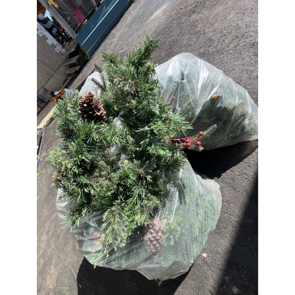 three bags of beautifully lit holiday decoration, garland