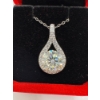 Image 1 : 3ct Round Moissanite with 24 Round Cubic Zirconia in Tear Drop Halo in 925 Silver Pendant