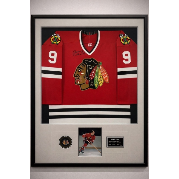 This is a framed, autographed Chicago Blackhawks jersey signed by Bobby Hull. 

