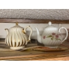 Image 2 : Collection of tea pots cookie Jars & various tin canisters .