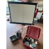 Image 1 :  antique 8mm projector with film and collapsing screen