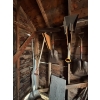 Image 6 : All Yard items on the wall, including pitchforks shovels brooms all sorts of shovels chains 