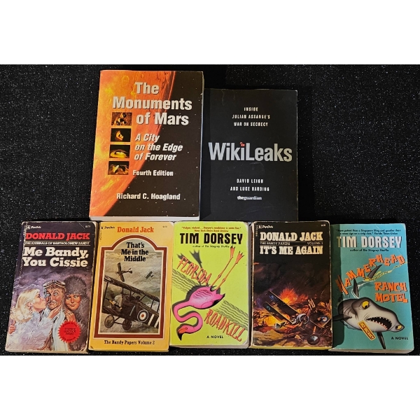 Seven Books by Various Authors, Including Tim Dorsey and Richard C. Hoagland