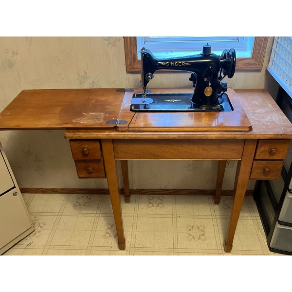 antique electric singer, sewing machine in great condition with a number of accessories and sewing t