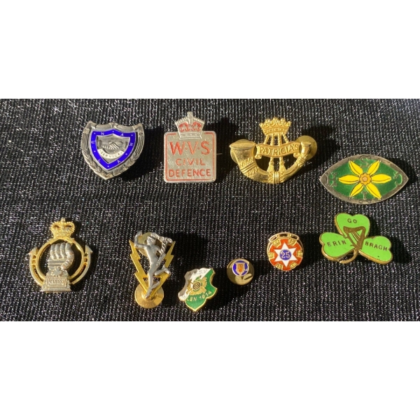 Collection of Vintage Military and Civilian Badges and Pins