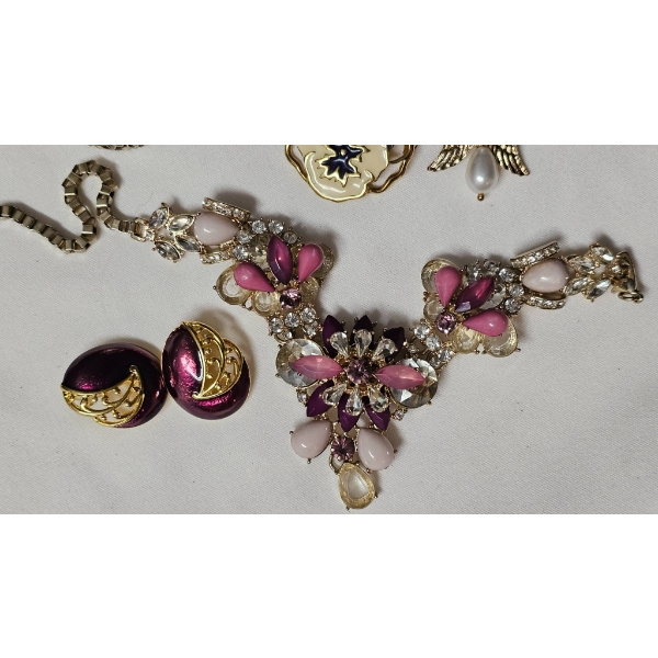 Vintage Jewelry and Collectibles Including Necklace, Brooches, and Stamps Tokens in Clutch Purse