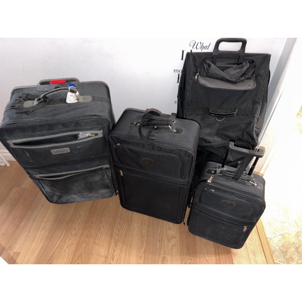 Four Black Softside Suitcases