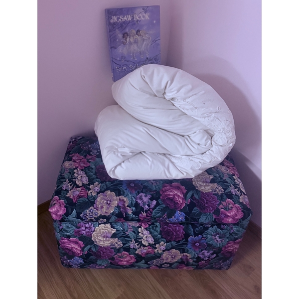 Floral Upholstered Storage Ottoman With Quilts and Cushions