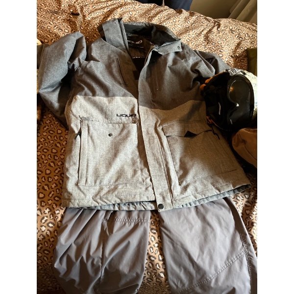 Ski pants xl, ski jacket XL with ski helmet with goggles and a Calgary stampede touring backpack.