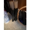 Image 4 : variety of umbrellas, sandals, and a pair of black boots, including basket and ceramic umbrella hold