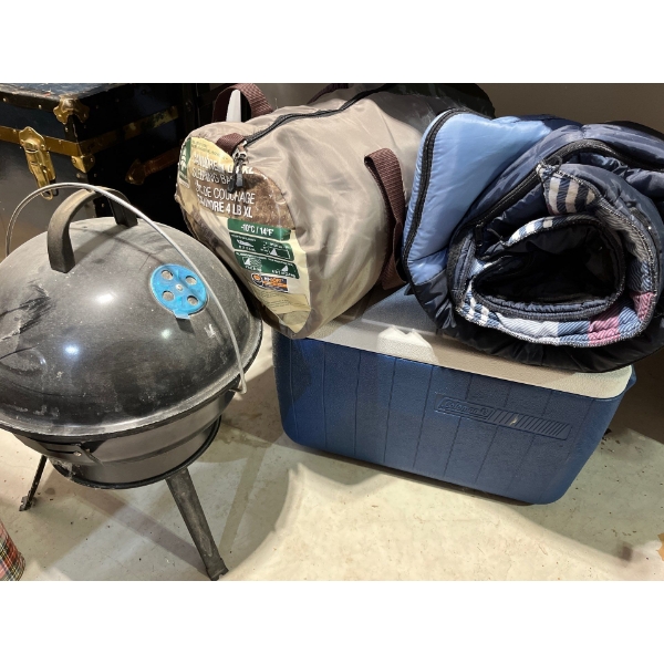 mini charcoal camp barbeque with two sleeping bags good to -10 and a blue Coleman cooler
