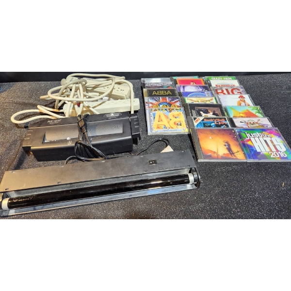 Assorted CDs, Paper Shredder, Black Light, and Power Bars