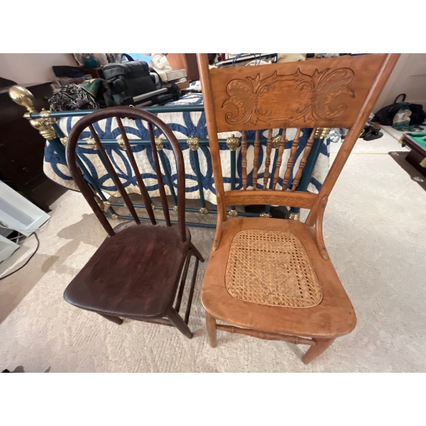 two antique chairs and one leather office chair