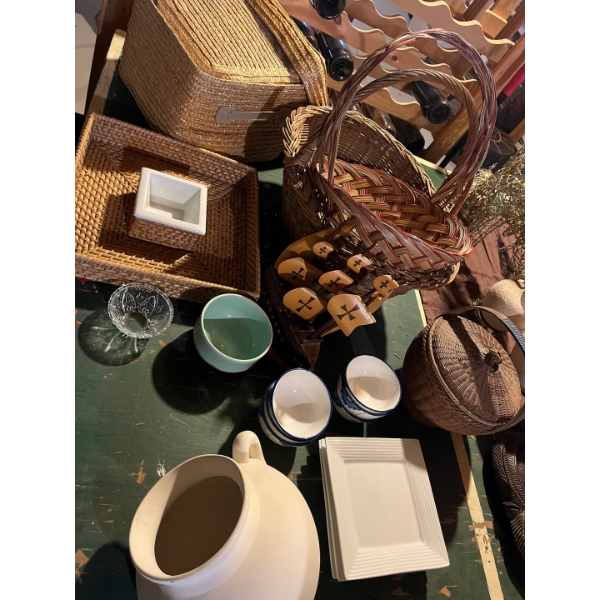 collection of baskets, miscellaneous bowls, serving trays and a little wooden ship