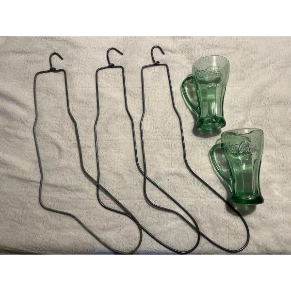 Antique Sock stretchers with 2 vintage Coke green coloured glasses