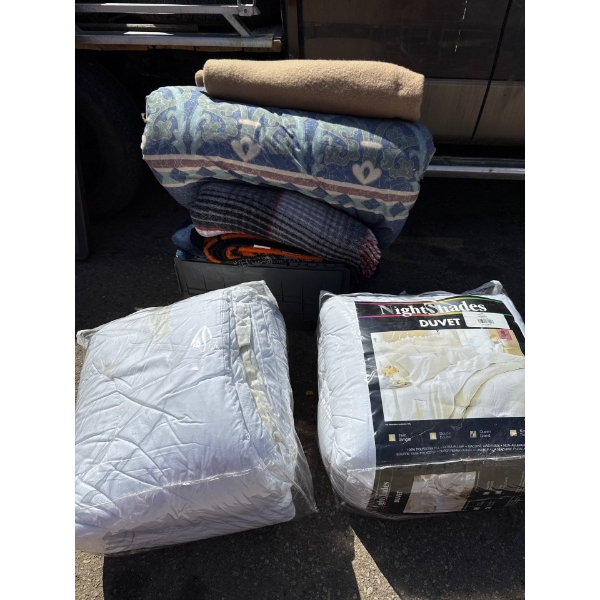 queen duvet and assorted blankets with storage bin
