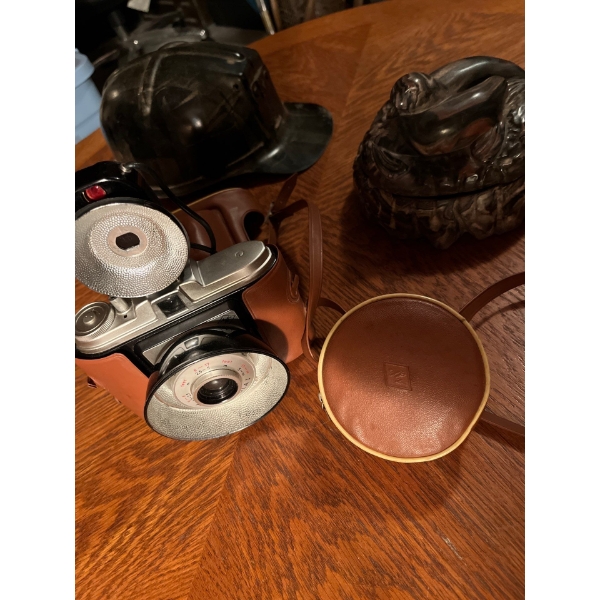  Vintage camera helmet and a sea lion sculpture candy dish