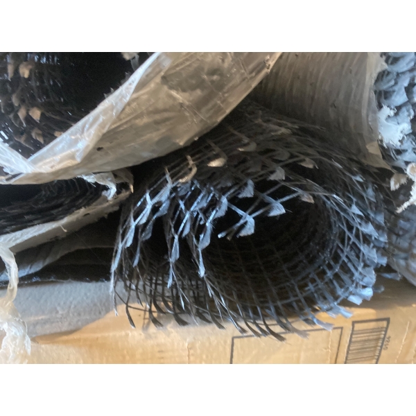 Rolls of Black Plastic Mesh Fencing Material on Pallet