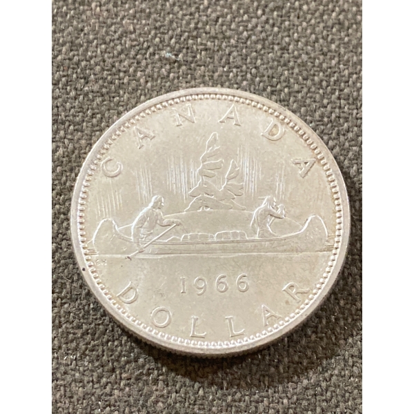 1966 Canadian Silver Dollar Featuring Voyageur and Queen Elizabeth II