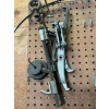 Image 2 : pegboard with various tools, including bolt cutters gear, polars, hacksaw, bungee cords, vice grips,