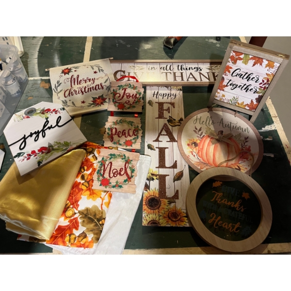 collection of Christmas signs and other seasonal signs for fall and Christmas as well as seasonal ta