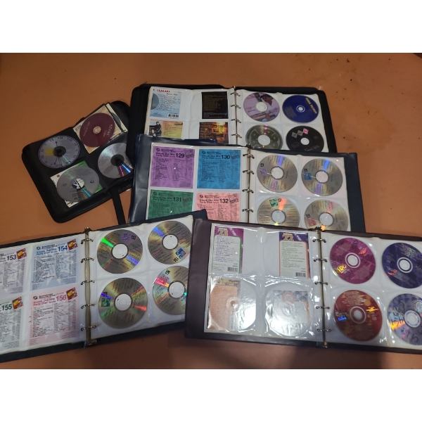 CD's in Binders Including East Coast Music and Curated DJ "Knock Out Hits" 