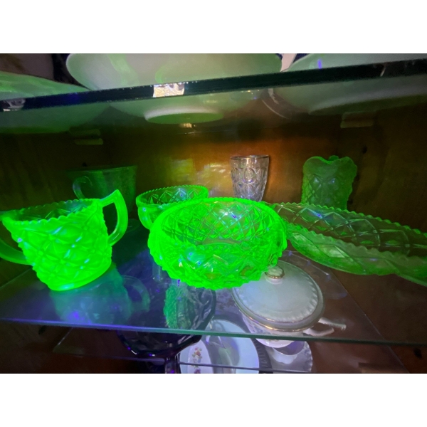  collection of green uranium glass on shelf four