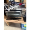 Image 4 : Kitchen Essentials Including Oven, Dishware, and Utensils